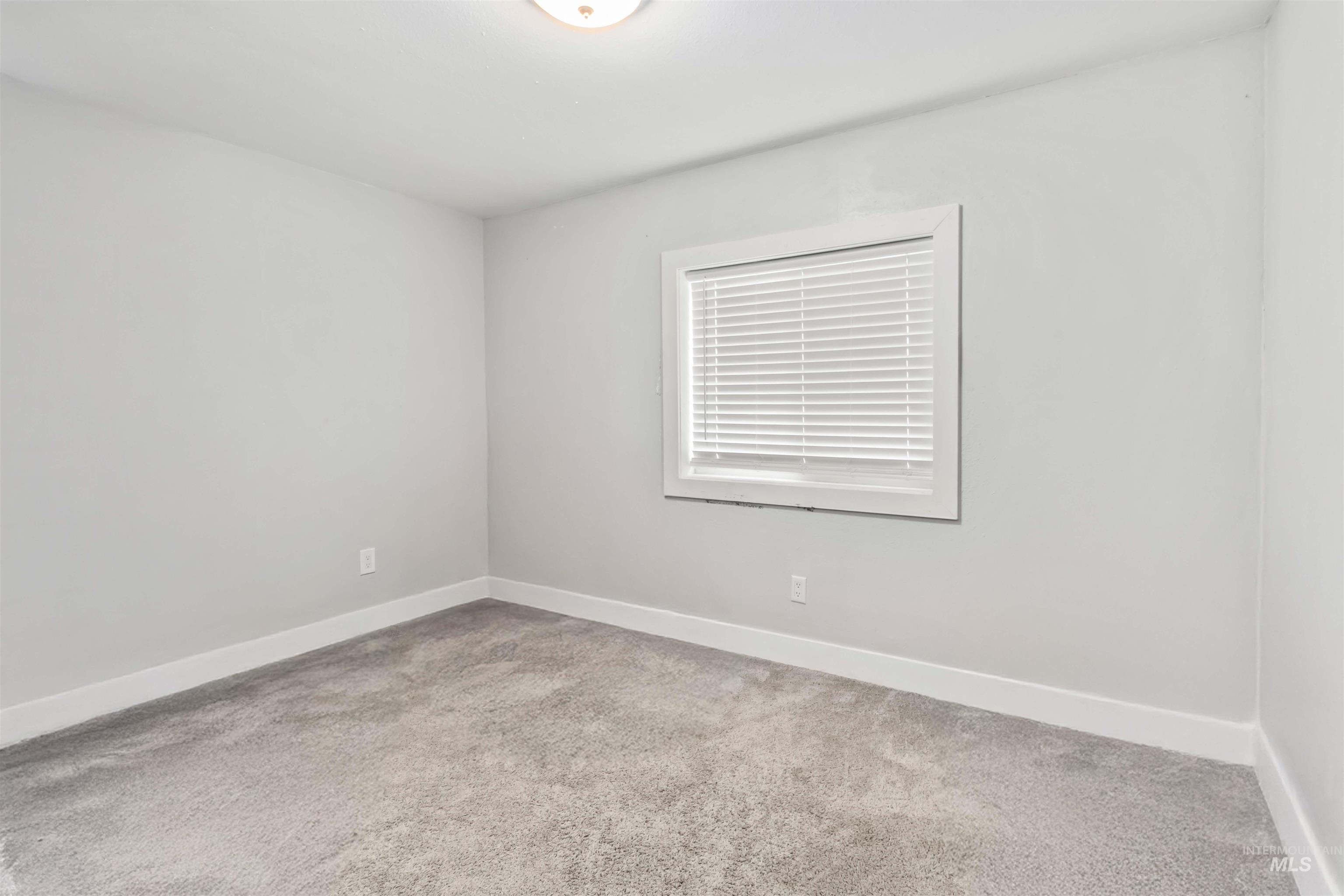 5827 East Little Basin Road King Hill, ID 83633 - Photo 25 of 47 Spare room with light colored carpet and baseboards