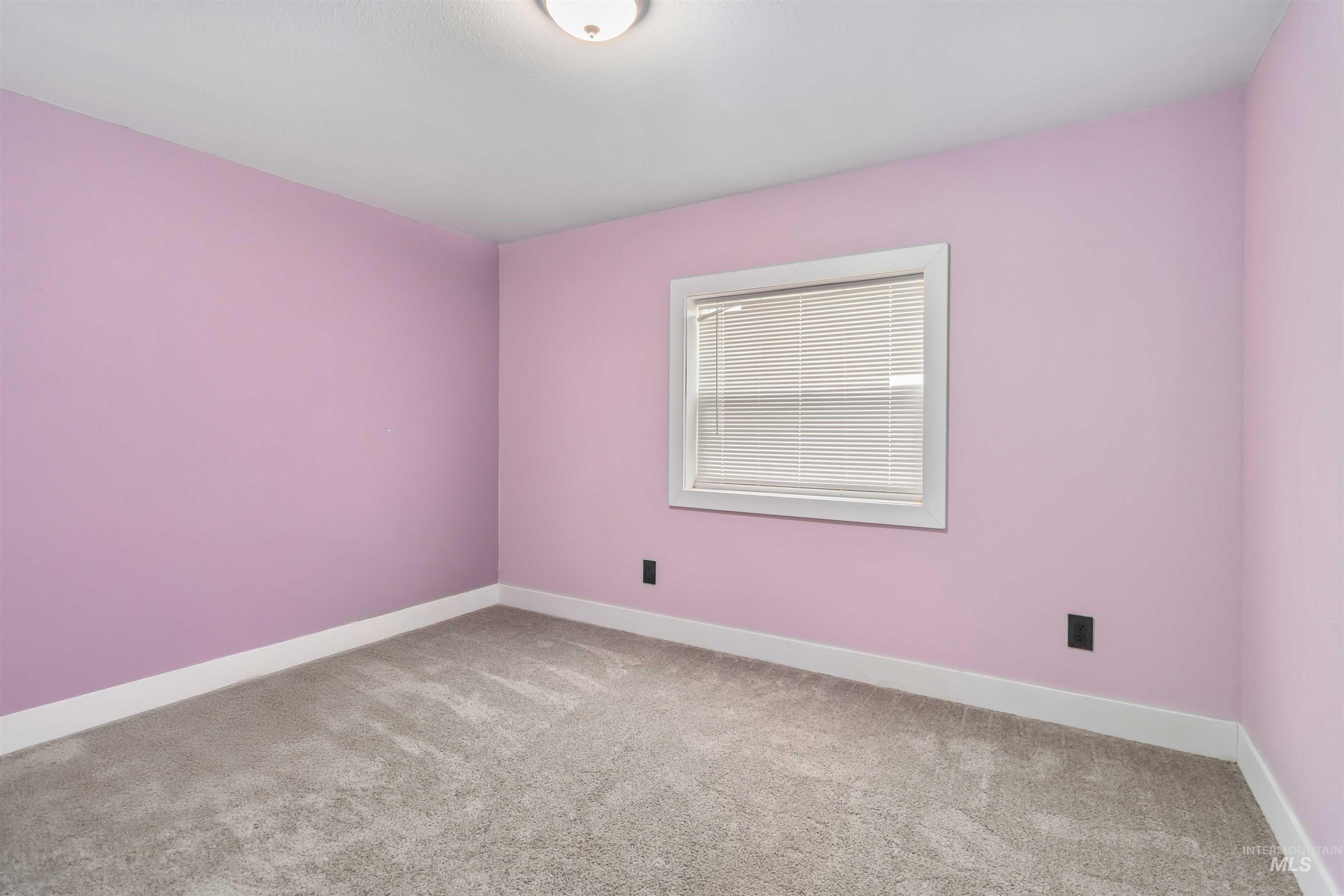 5827 East Little Basin Road King Hill, ID 83633 - Photo 26 of 47 Empty room with light carpet and baseboards