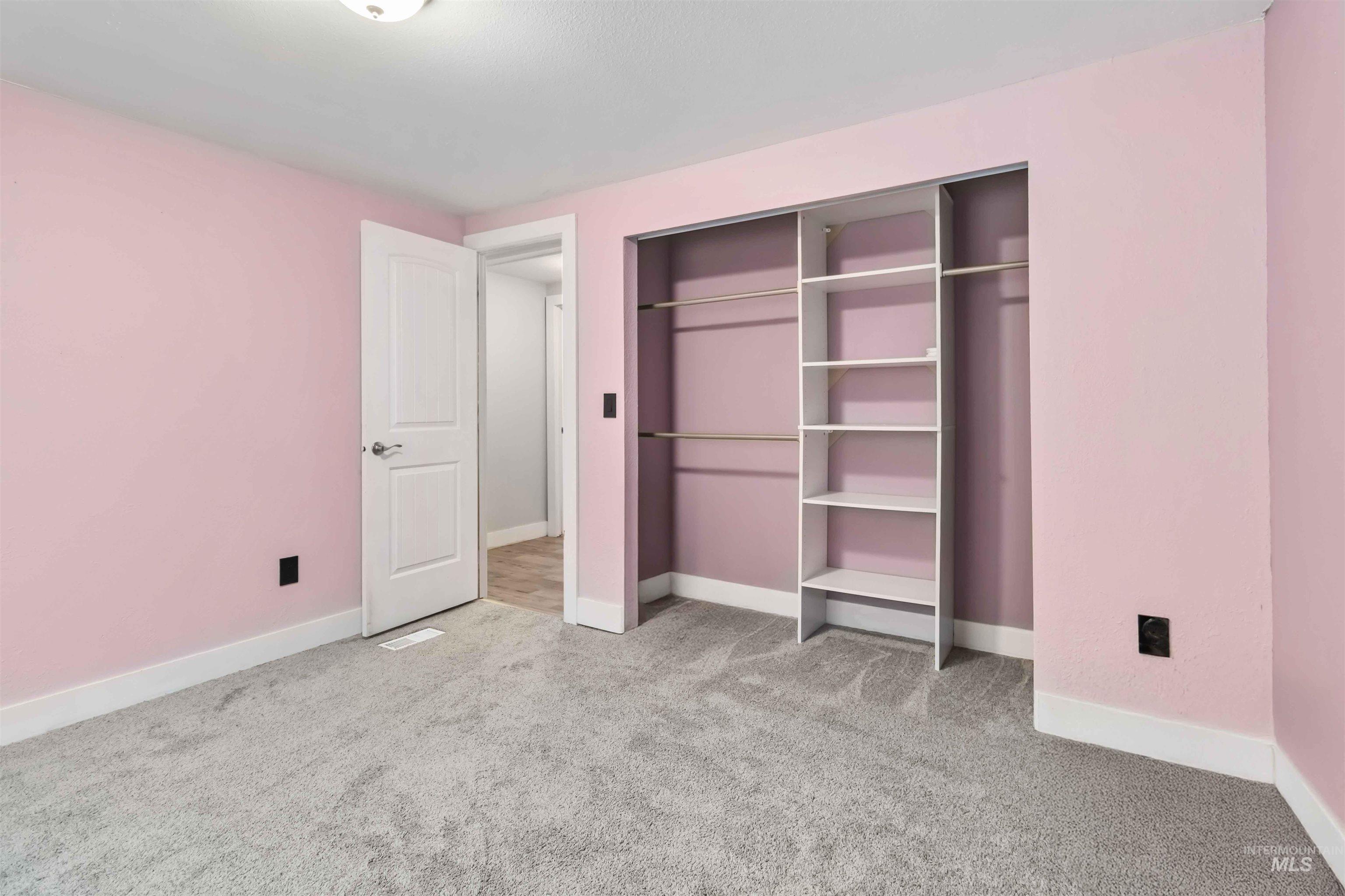 5827 East Little Basin Road King Hill, ID 83633 - Photo 27 of 47 Unfurnished bedroom featuring light colored carpet and a closet