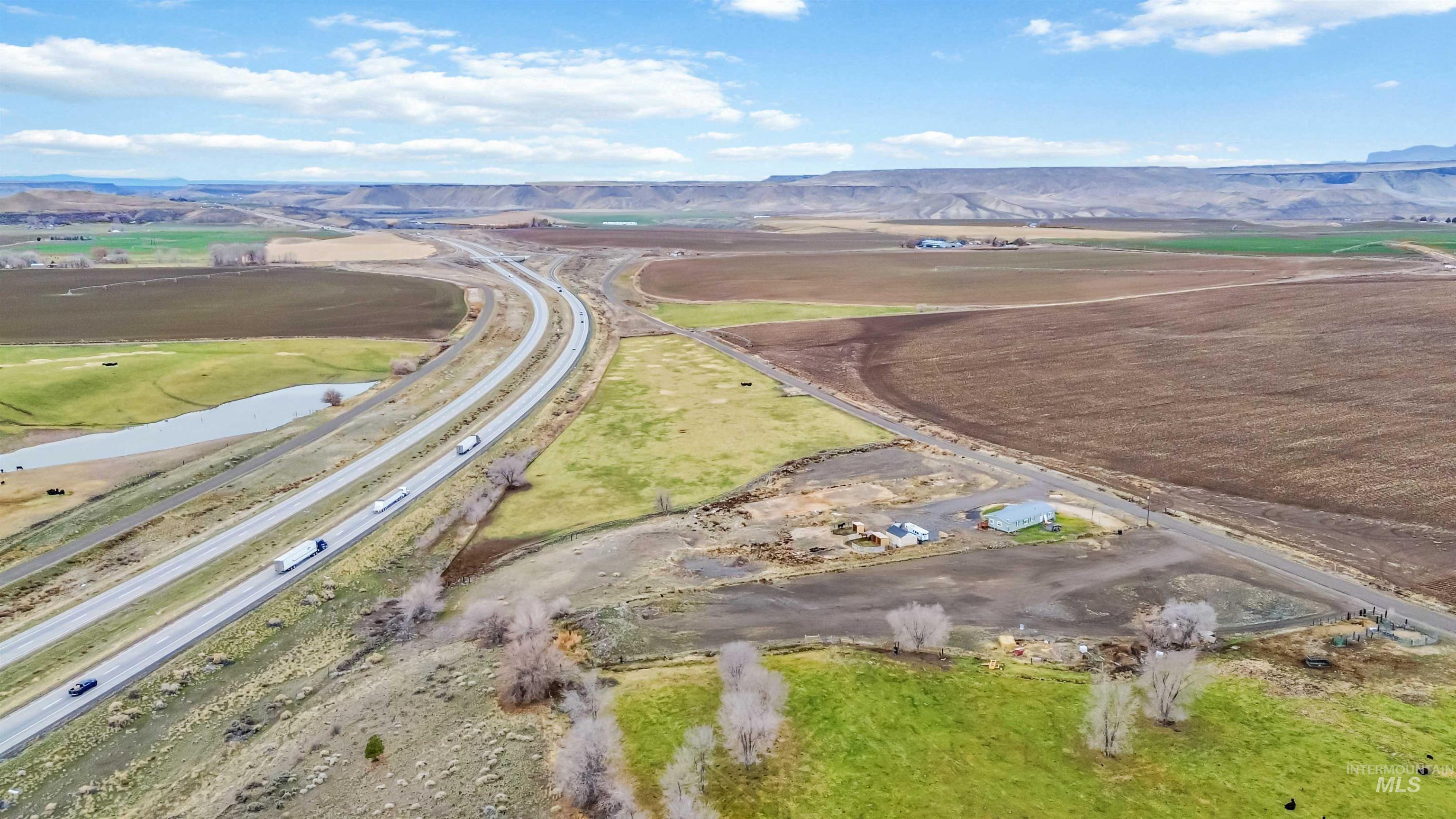 5827 East Little Basin Road King Hill, ID 83633 - Photo 36 of 47 Aerial overview of property's location featuring rural landscape and a mountain backdrop