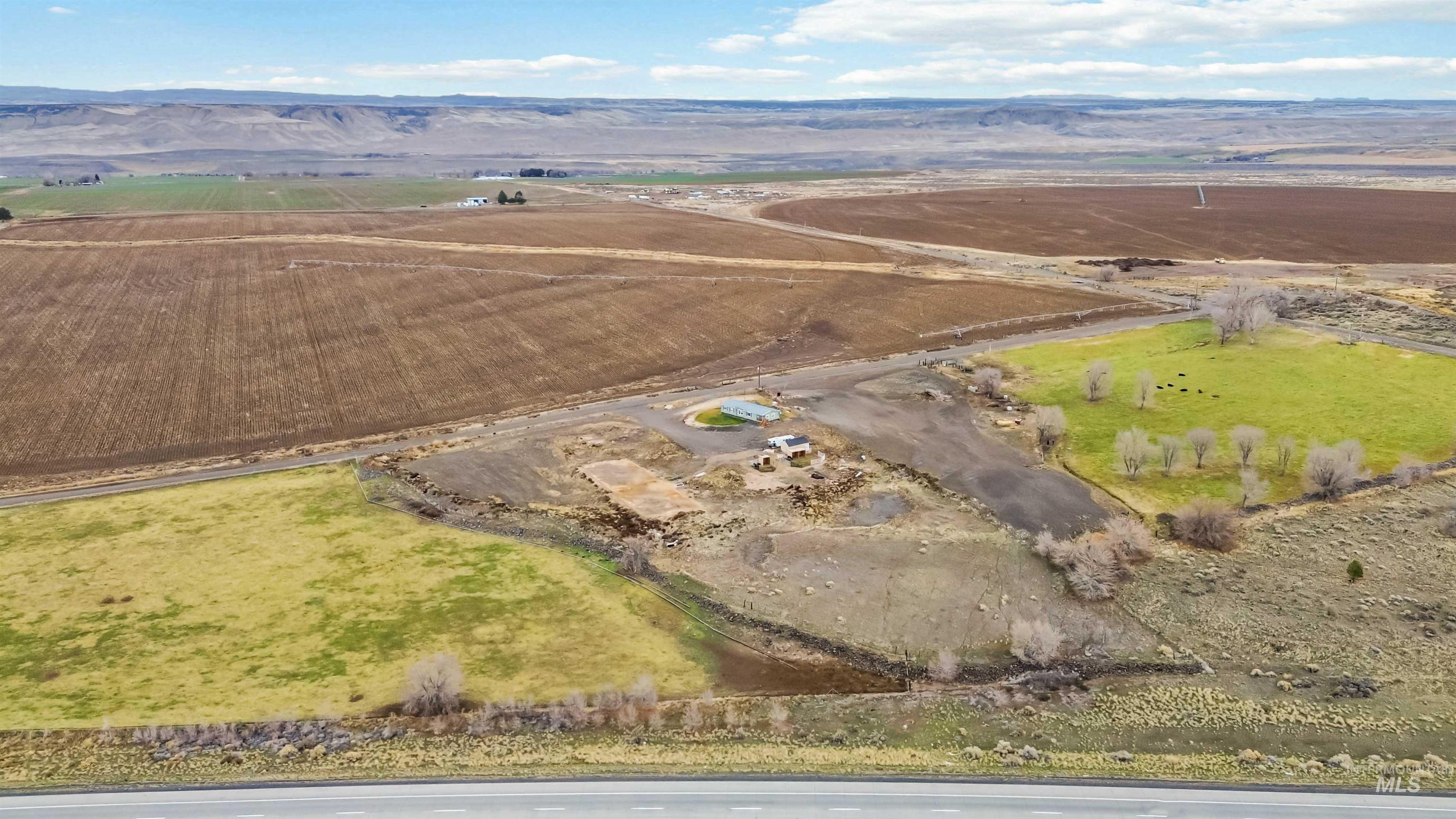 5827 East Little Basin Road King Hill, ID 83633 - Photo 40 of 47 Aerial overview of property's location with rural landscape and a mountain backdrop