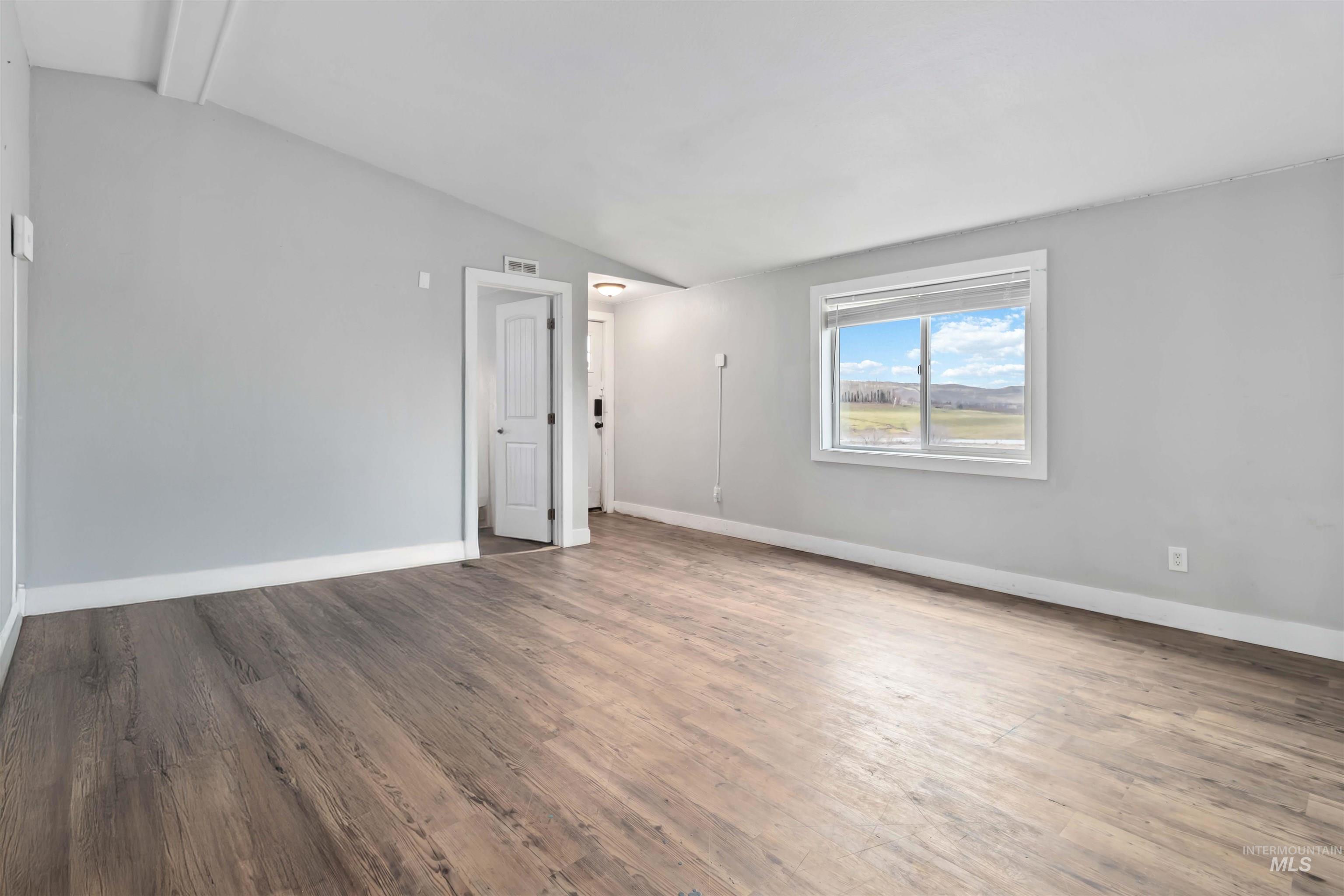 5827 East Little Basin Road King Hill, ID 83633 - Photo 10 of 47 Unfurnished room with wood finished floors and baseboards