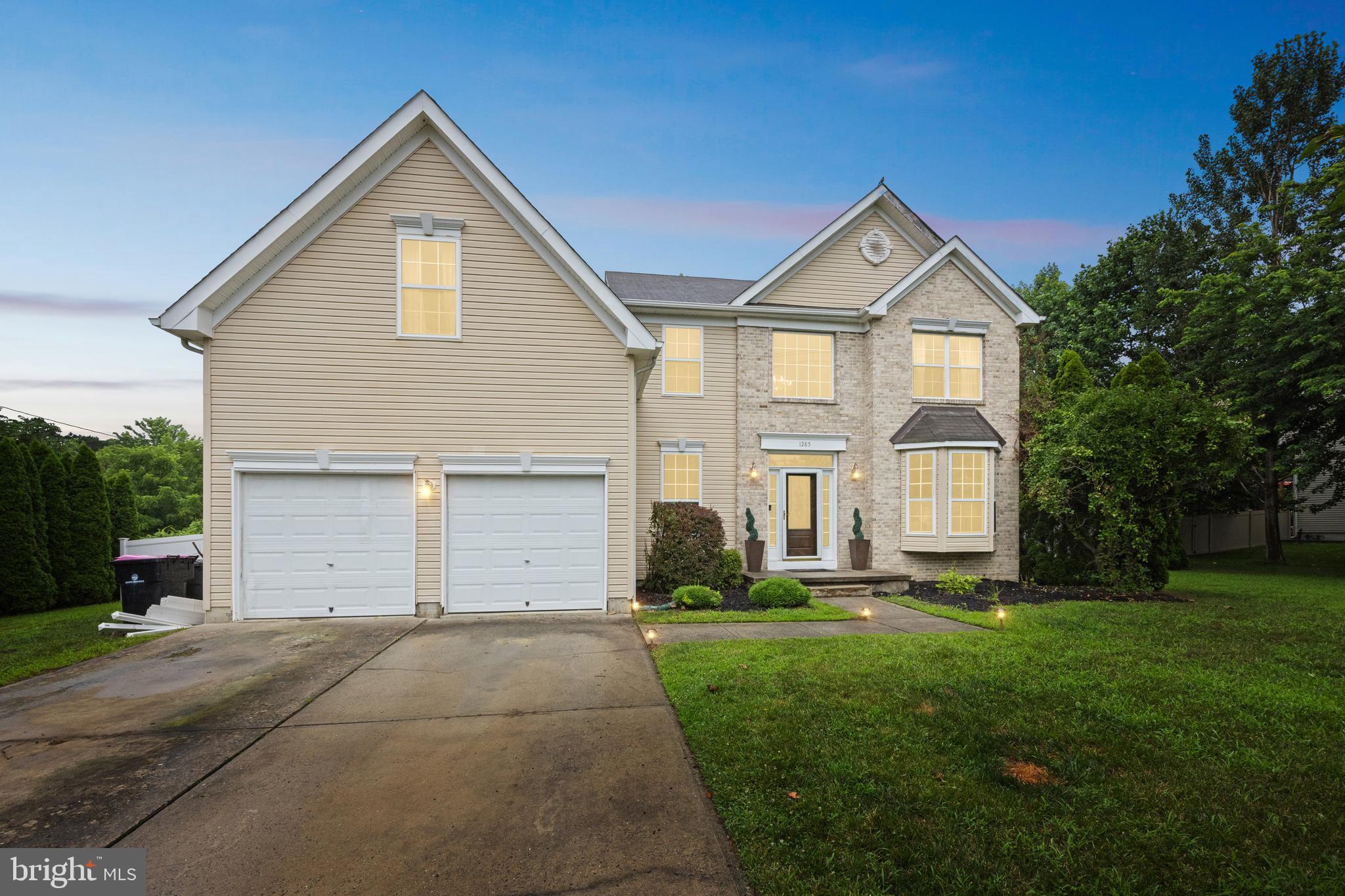 1285 Kearsley Road Sicklerville, NJ 08081 - Photo 1 of 34 a front view of a house with a yard and garage