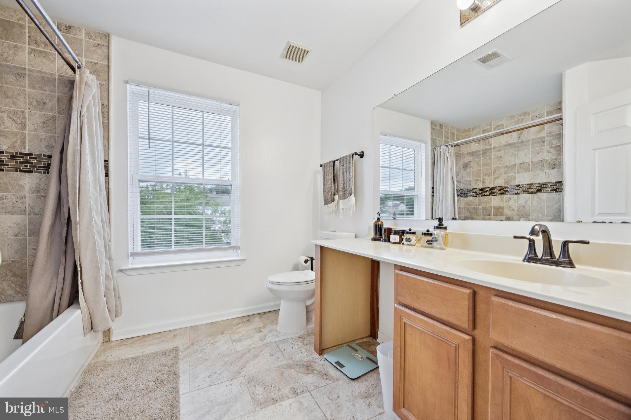 1285 Kearsley Road Sicklerville, NJ 08081 - Photo 22 of 34 a bathroom with a sink toilet and tub