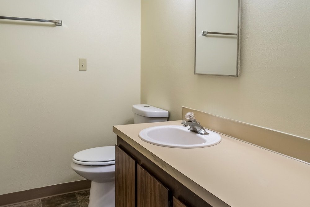 319 Southwest G Street Madras, OR 97741 - Photo 9 of 10 a bathroom with a sink a toilet and a mirror