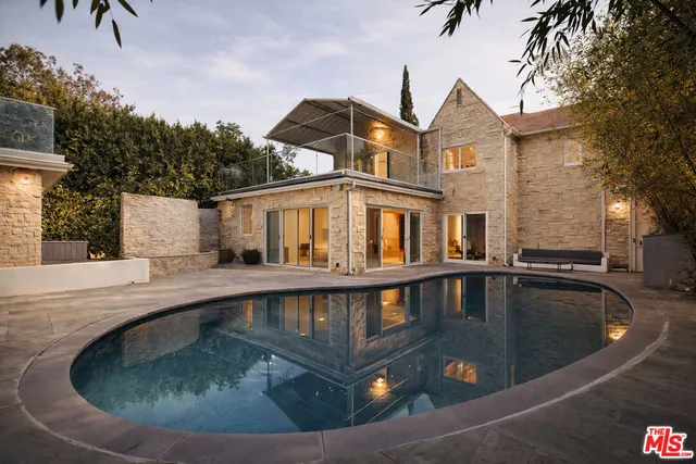 a view of a house with swimming pool