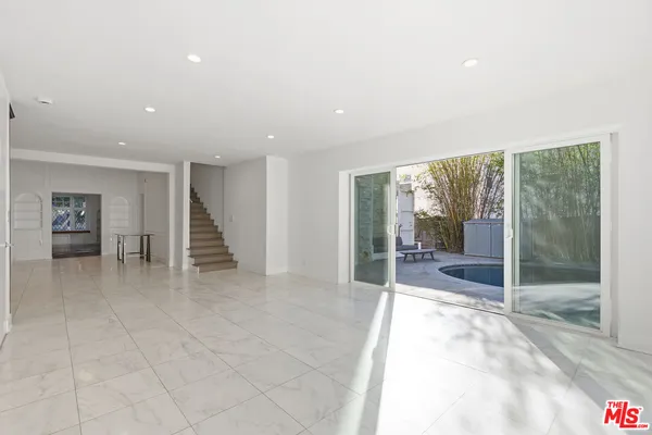 a view of a terrace with chairs and a fire pit