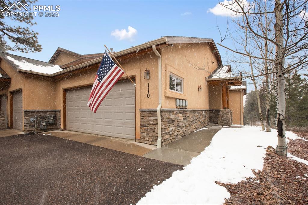 110 Elk Grove Lane Woodland Park, CO 80863 - Photo 1 of 31 a front view of a house with a yard