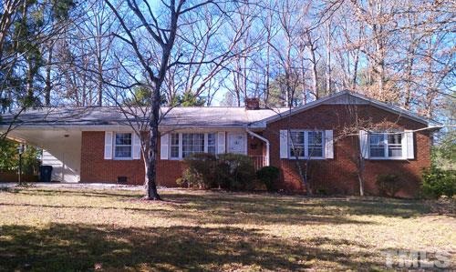 1007 Akron Avenue Durham, NC 27713 - Photo 1 of 8 a front view of a house with a yard