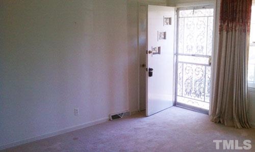 1007 Akron Avenue Durham, NC 27713 - Photo 7 of 8 a view of an empty room and a window