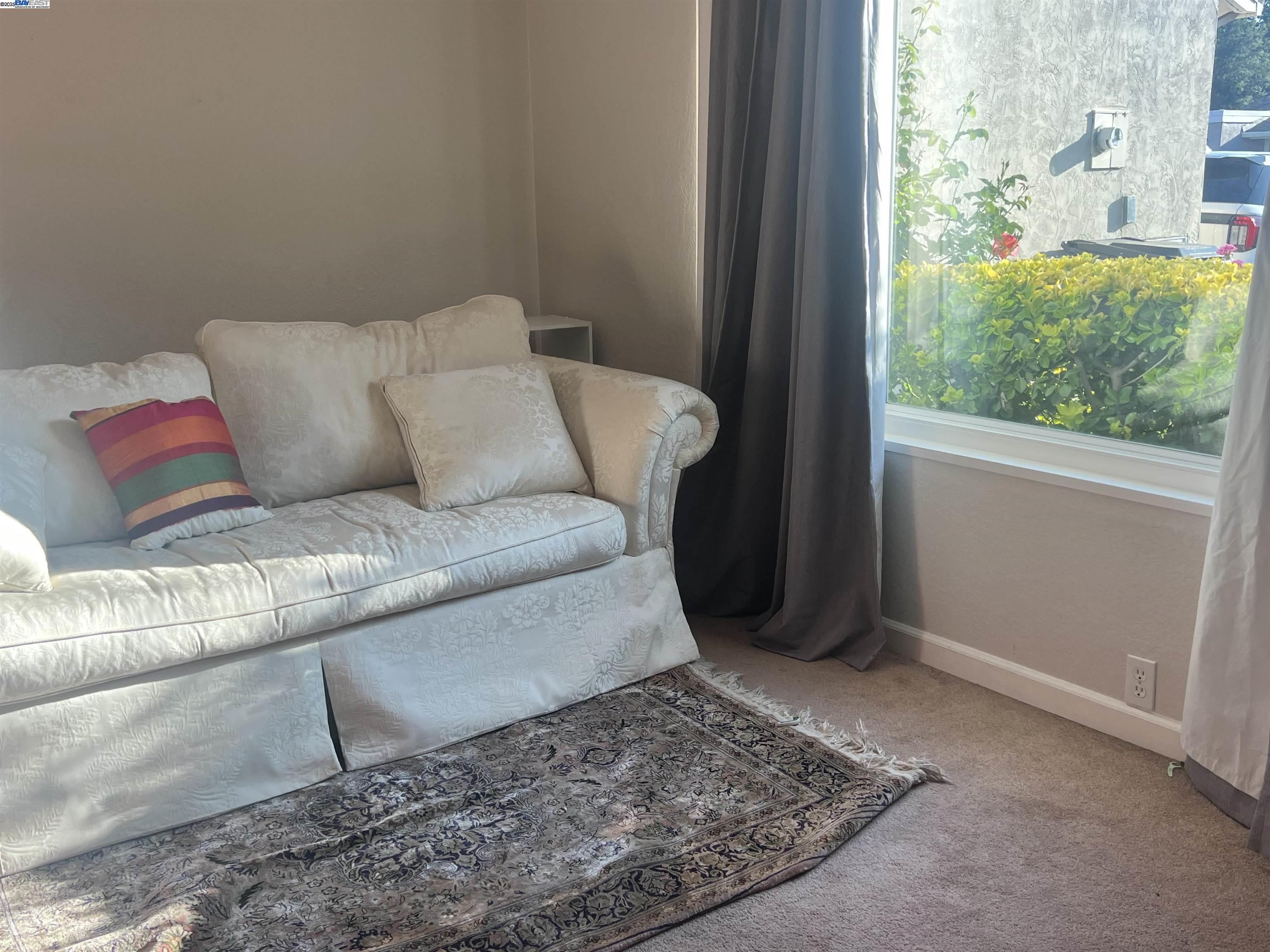 2155 Goldcrest Circle Pleasanton, CA 94566 - Photo 4 of 14 a living room with furniture and a rug