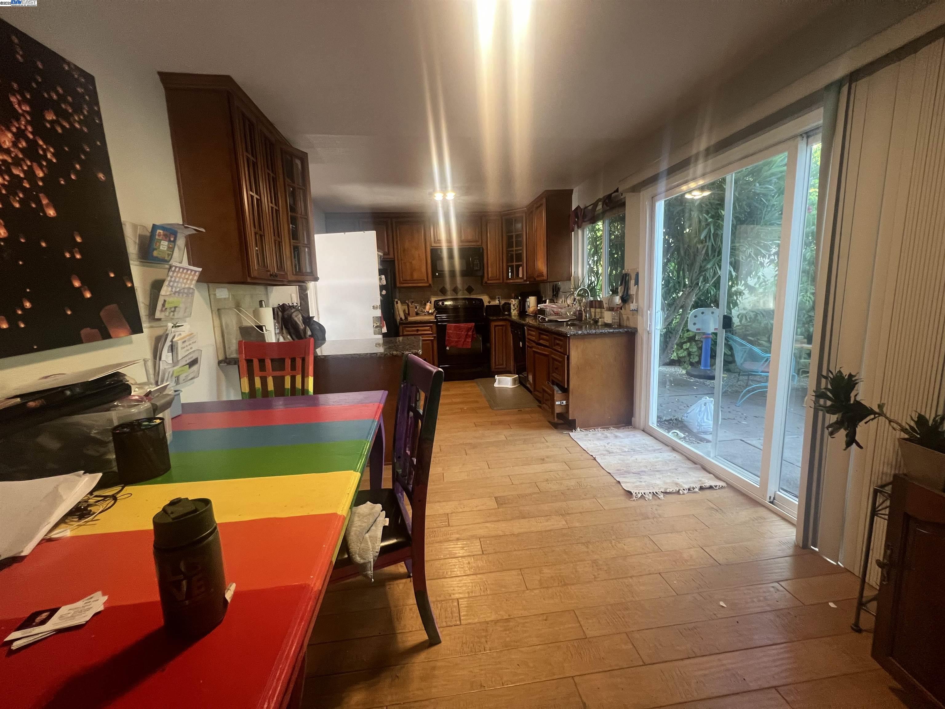 2155 Goldcrest Circle Pleasanton, CA 94566 - Photo 6 of 14 a living room with furniture dining table and a large window