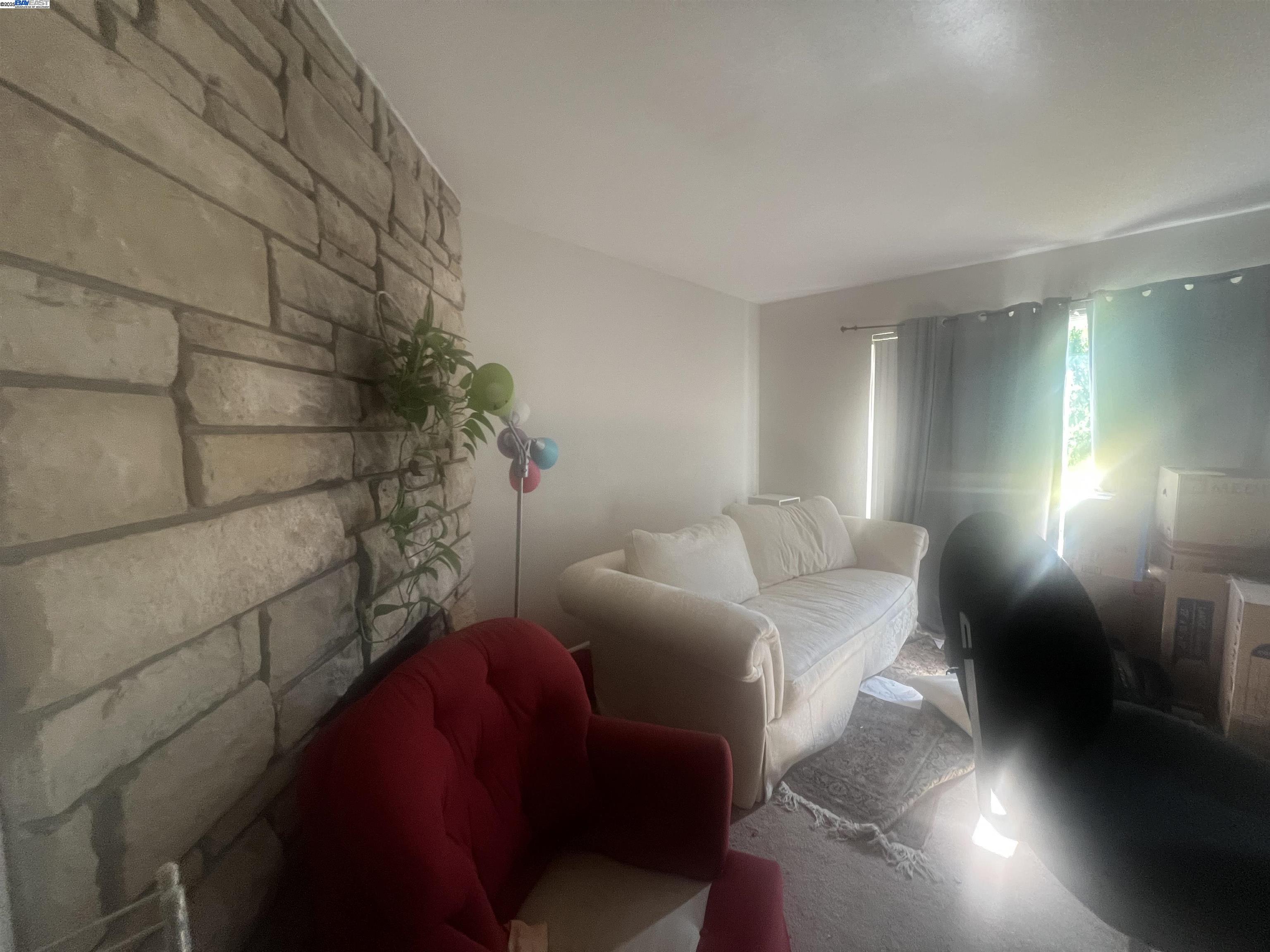 2155 Goldcrest Circle Pleasanton, CA 94566 - Photo 7 of 14 a living room with furniture and a potted plant