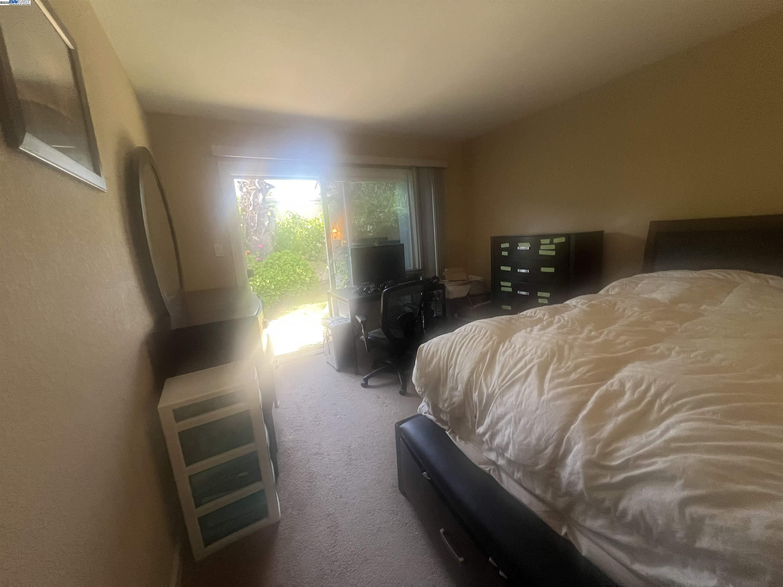 2155 Goldcrest Circle Pleasanton, CA 94566 - Photo 8 of 14 a bedroom with a bed and a view of balcony