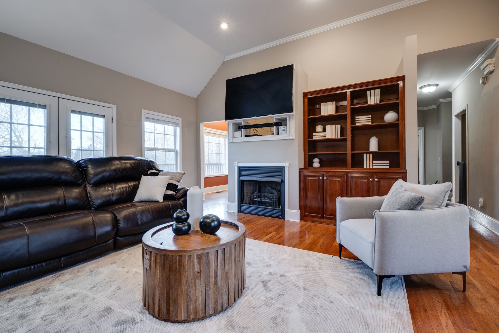 754 Hafner Road Charlotte, TN 37036 - Photo 13 of 54 a living room with furniture a flat screen tv and a fireplace