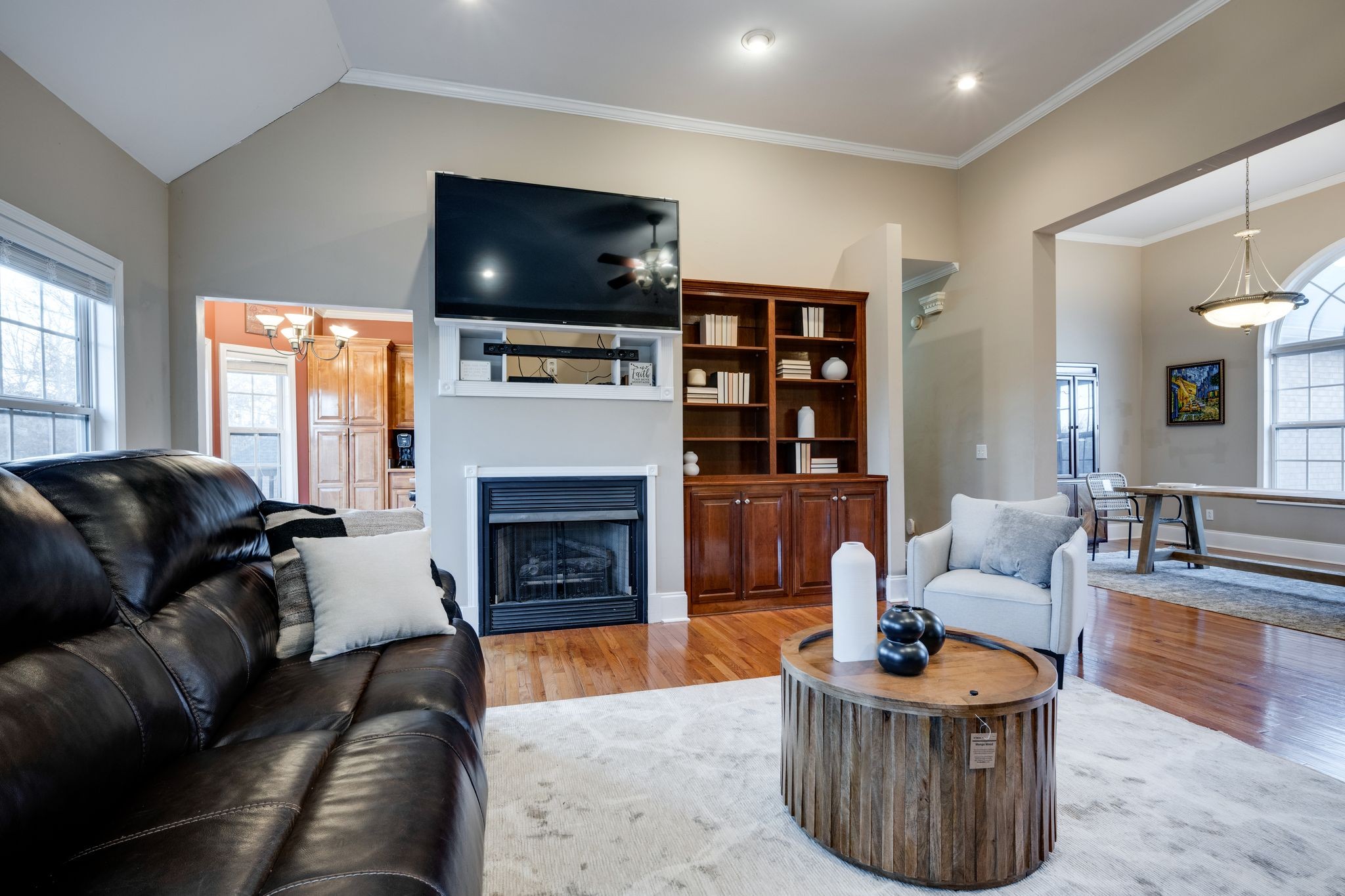 754 Hafner Road Charlotte, TN 37036 - Photo 15 of 54 a living room with furniture a flat screen tv and a fireplace