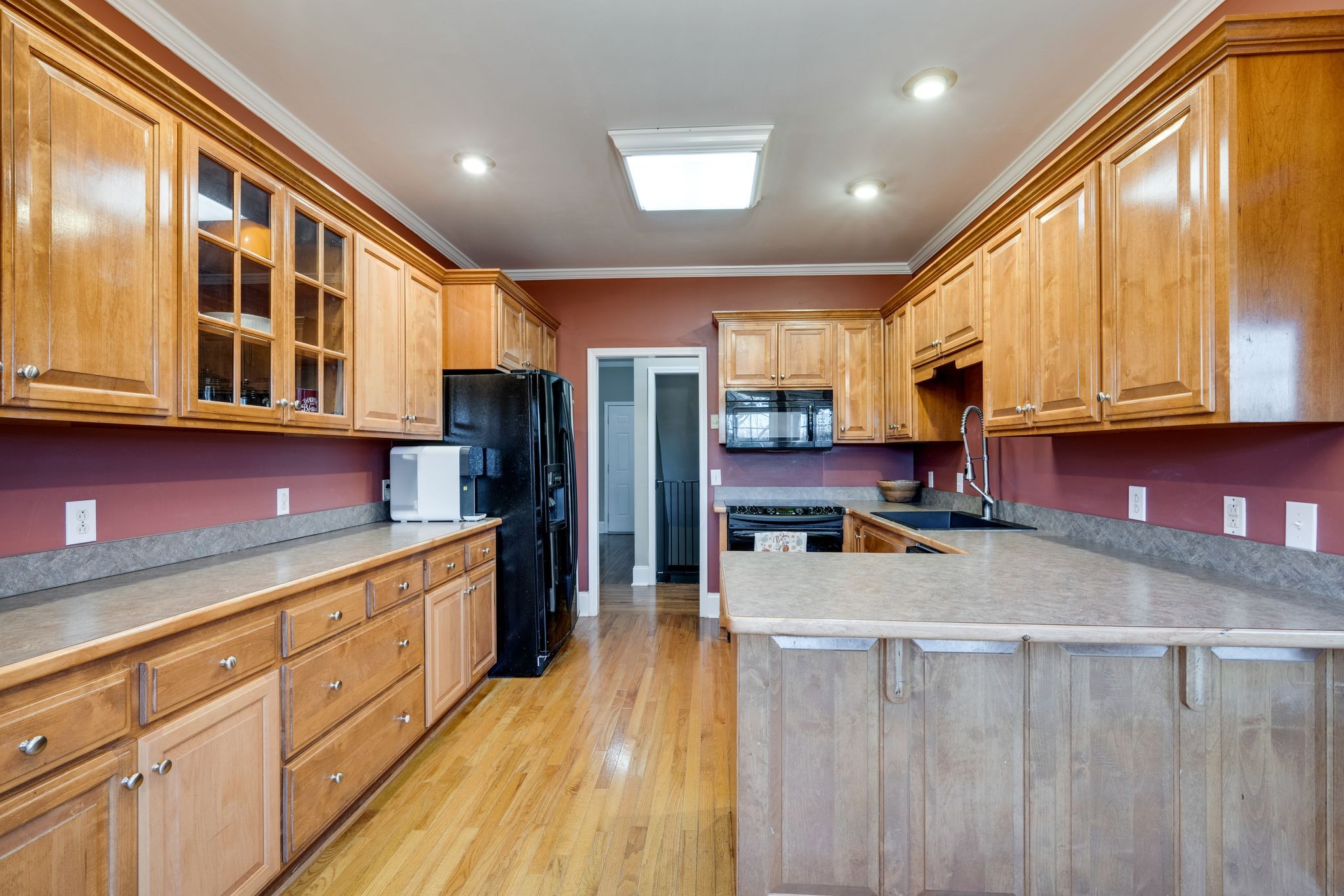 754 Hafner Road Charlotte, TN 37036 - Photo 17 of 54 a kitchen with stainless steel appliances granite countertop a stove and cabinets