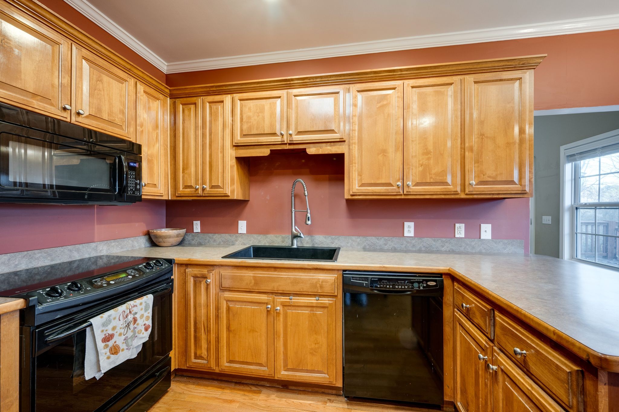 754 Hafner Road Charlotte, TN 37036 - Photo 19 of 54 a kitchen with stainless steel appliances granite countertop a stove and a microwave
