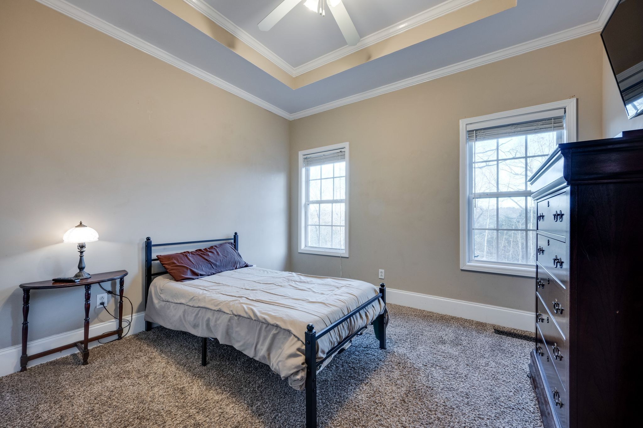 754 Hafner Road Charlotte, TN 37036 - Photo 26 of 54 a bedroom with a bed lamp and a window