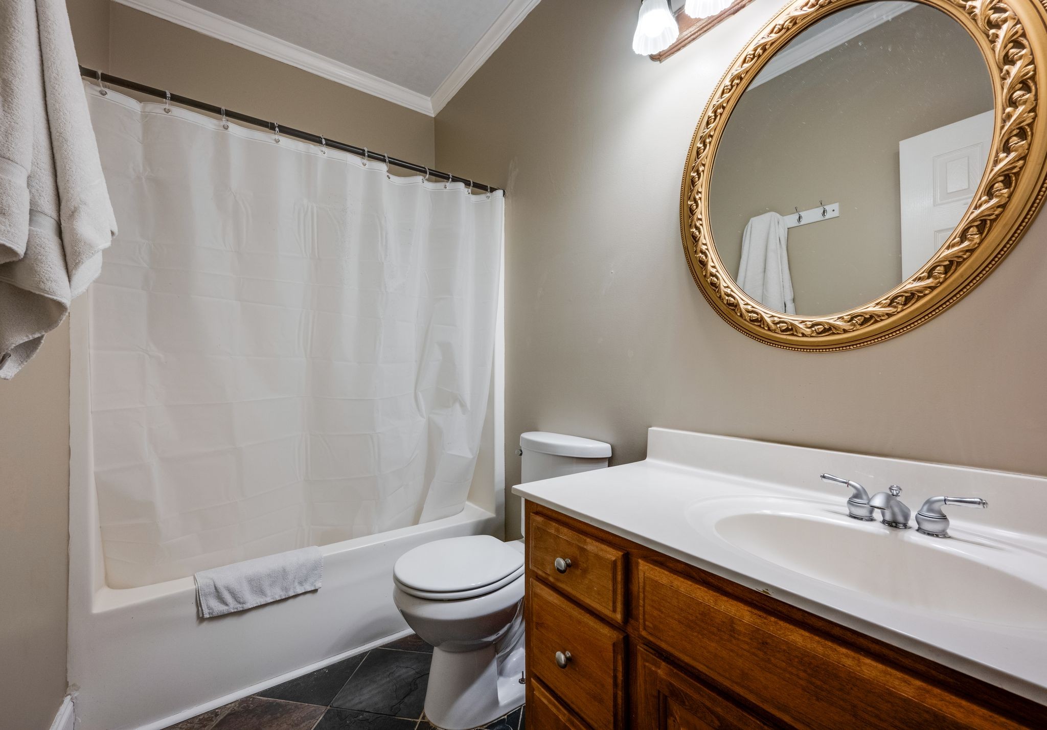 754 Hafner Road Charlotte, TN 37036 - Photo 28 of 54 a bathroom with a toilet a sink and a mirror