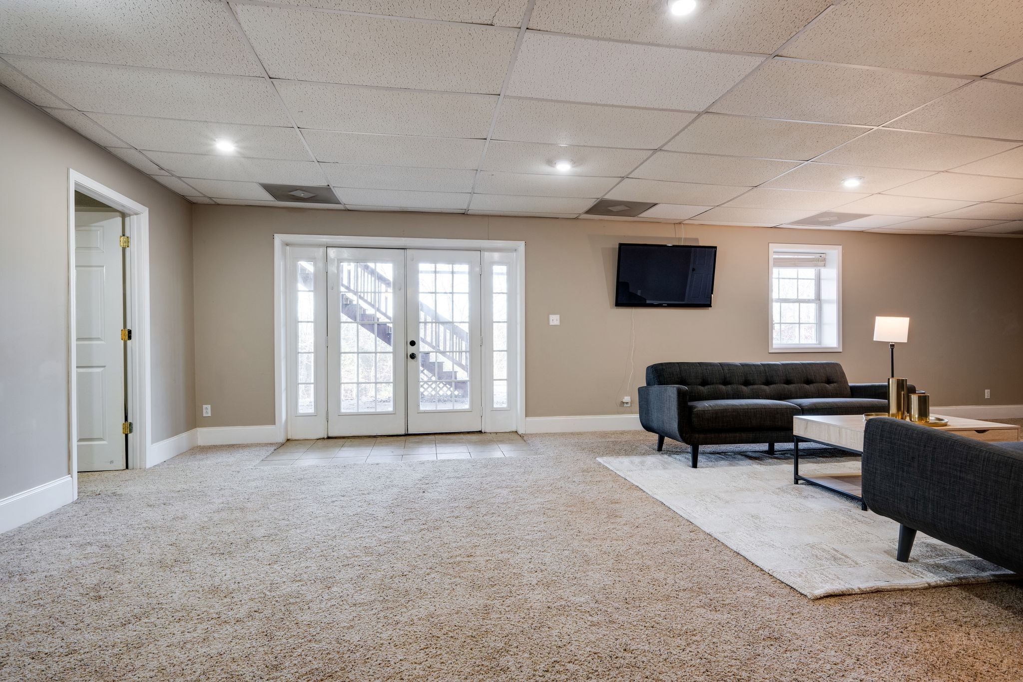 754 Hafner Road Charlotte, TN 37036 - Photo 34 of 54 a room with furniture a flat screen tv and a potted plant