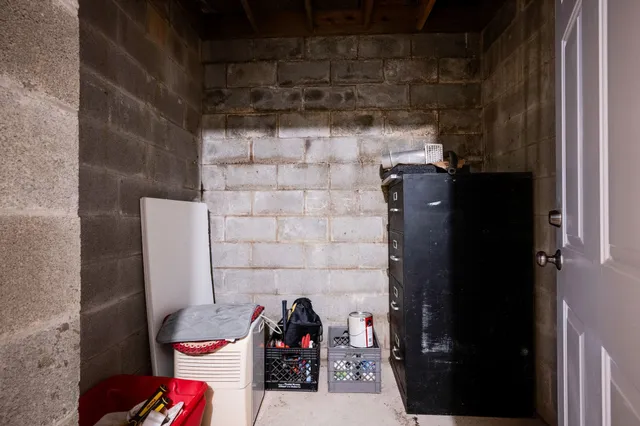 a view of a house with a yard next to a road