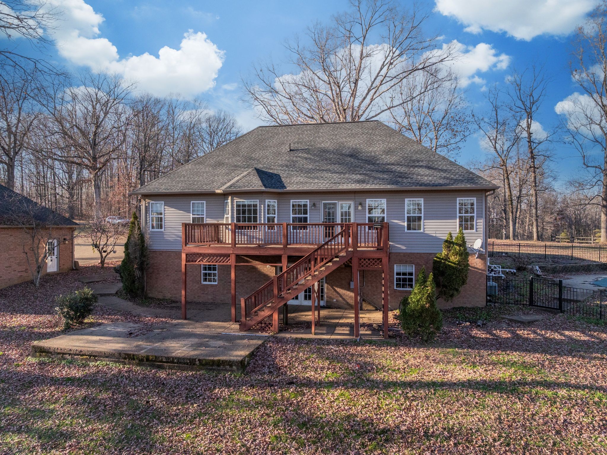 754 Hafner Road Charlotte, TN 37036 - Photo 42 of 54 a view of a house with a chairs and table in the patio