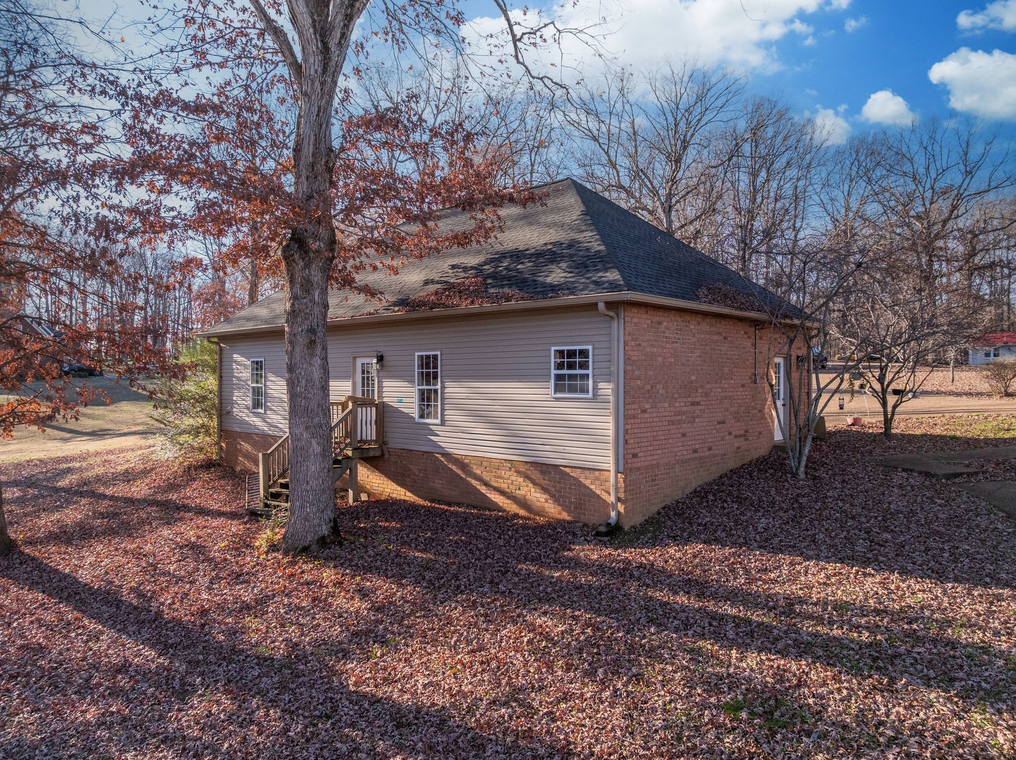 754 Hafner Road Charlotte, TN 37036 - Photo 44 of 54 a view of a house with a yard next to a road