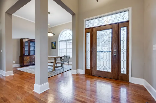 a view of a livingroom with furniture and a window