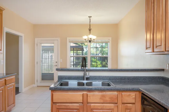 a kitchen that has a sink and a window