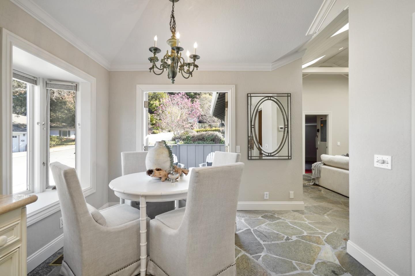 251 Gramercy Drive San Mateo, CA 94402 - Photo 15 of 40 a view of a dining room with furniture a chandelier and wooden floor