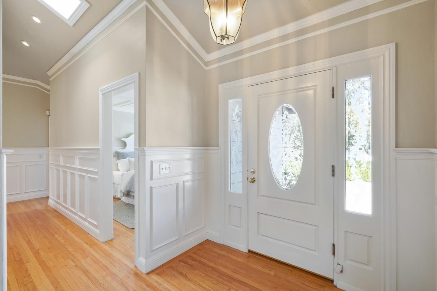 251 Gramercy Drive San Mateo, CA 94402 - Photo 2 of 40 a view of a hallway with wooden floor and front door