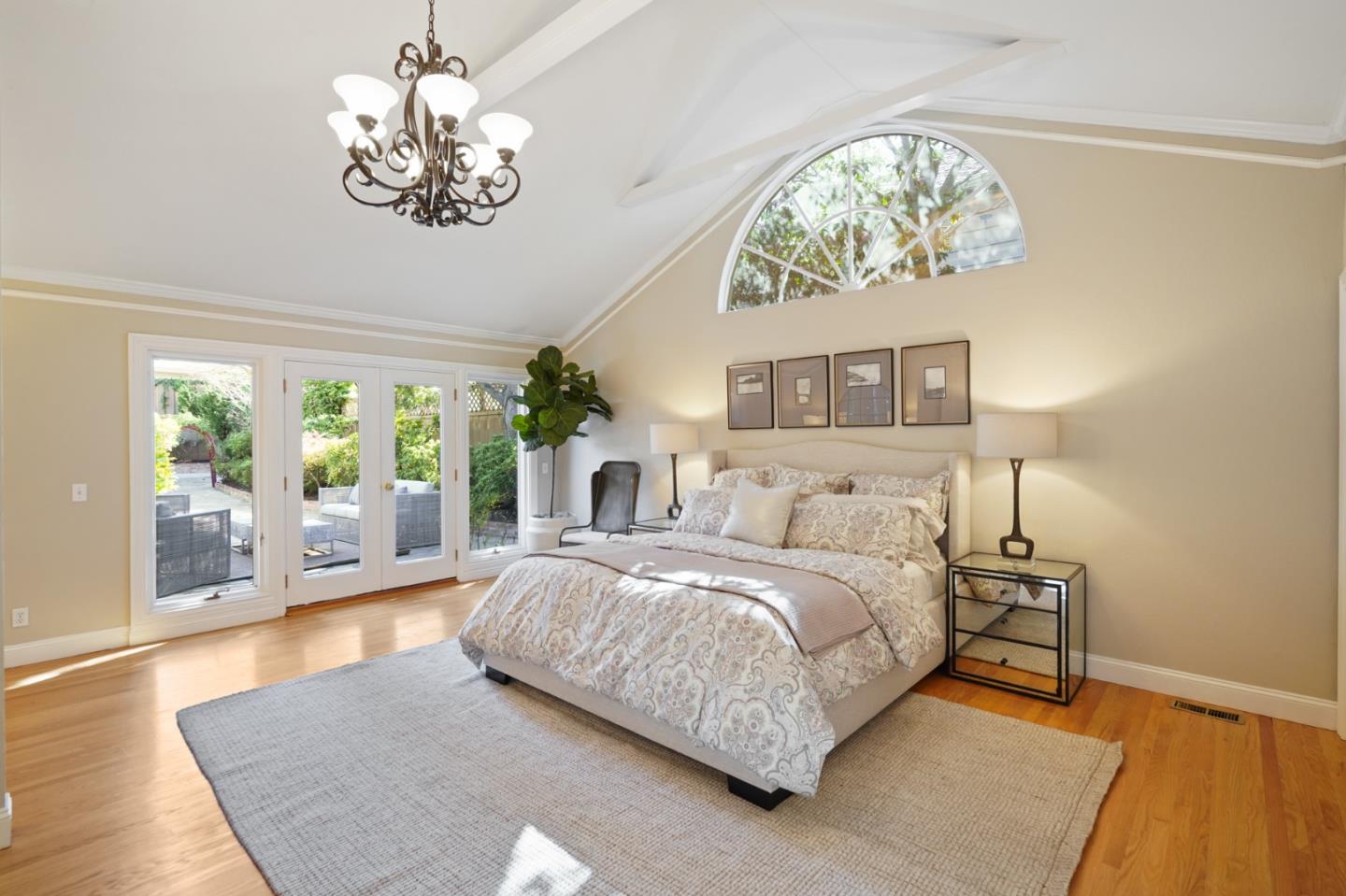 251 Gramercy Drive San Mateo, CA 94402 - Photo 27 of 40 a bedroom with a large bed and a chandelier