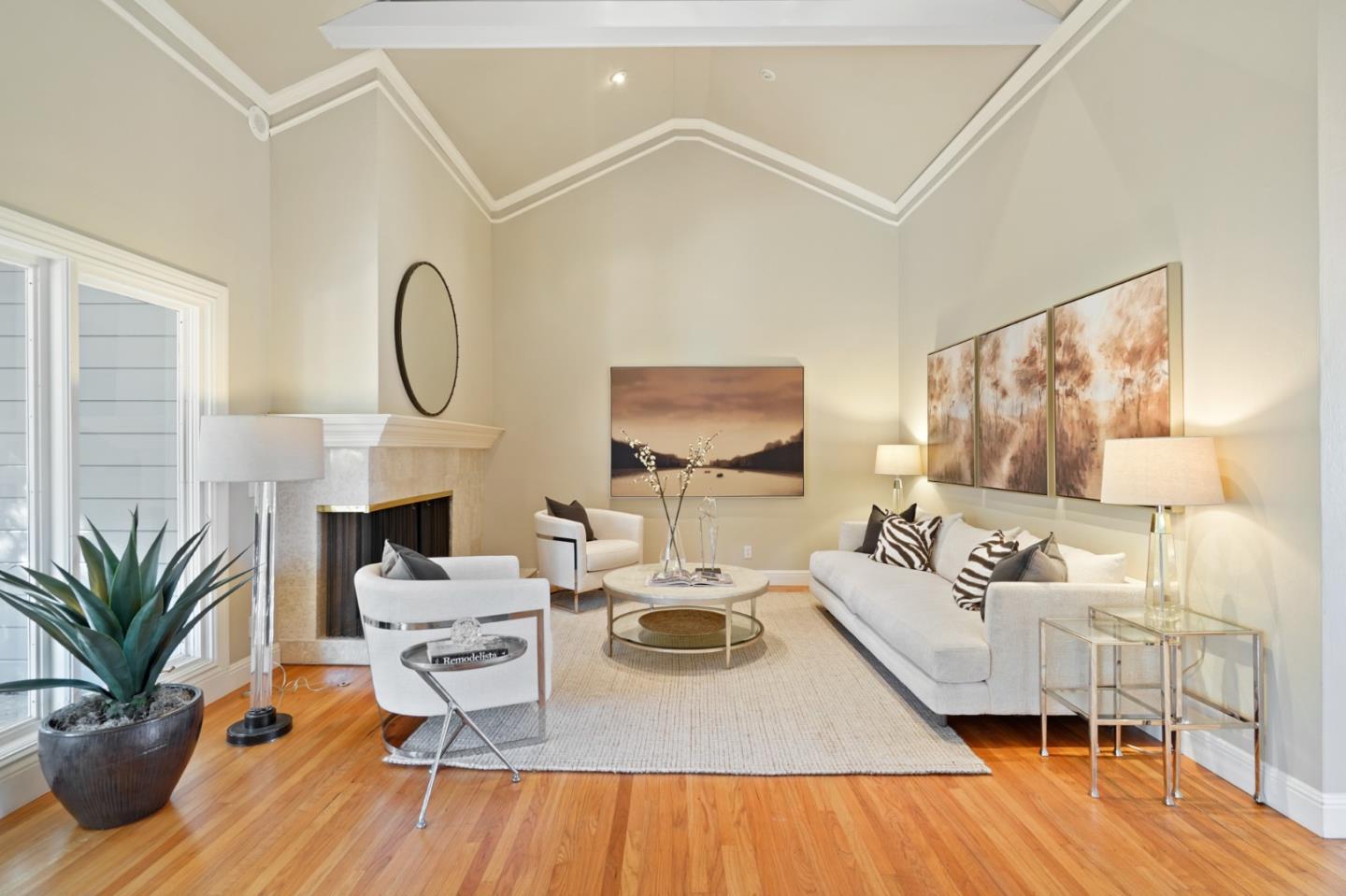 251 Gramercy Drive San Mateo, CA 94402 - Photo 4 of 40 a living room with furniture a fireplace and potted plants with wooden floor