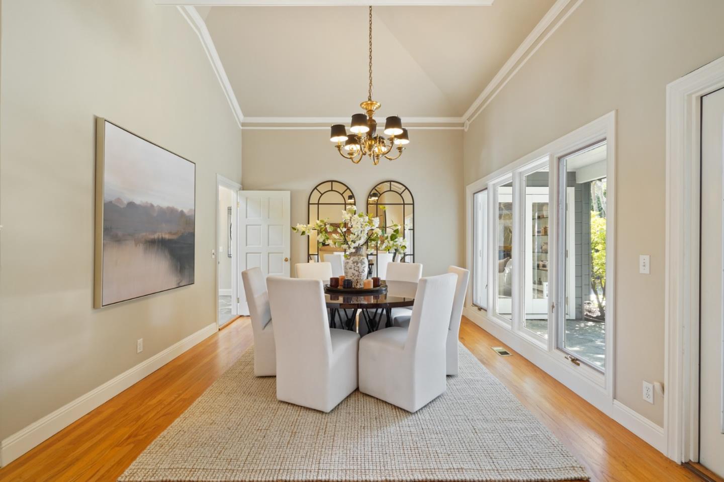 251 Gramercy Drive San Mateo, CA 94402 - Photo 9 of 40 a dining room with chandelier fan and wooden floor