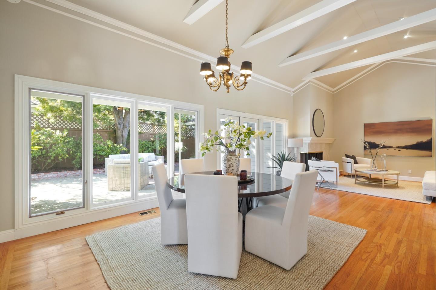 251 Gramercy Drive San Mateo, CA 94402 - Photo 10 of 40 a dining room with furniture a chandelier and wooden floor