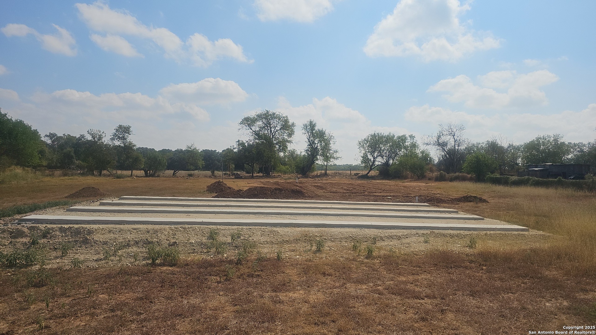 18000 Wisdom Road Lytle, TX 78052 - Photo 2 of 6 a view of outdoor space with playground and green space