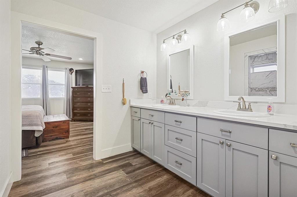 1161 Lynn Creek Road Jacksboro, TX 76458 - Photo 15 of 28 a spacious bathroom with double sink a mirror and a shower
