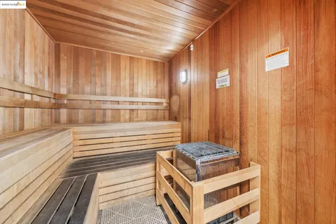 a view of a room with stairs and a rug