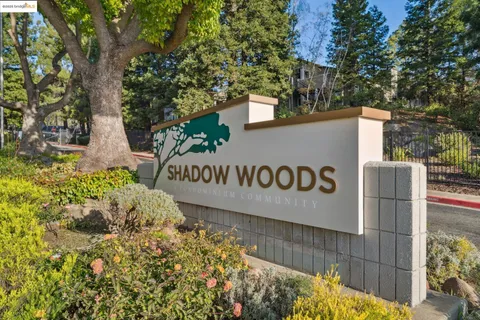 a sign broad in front of flowers