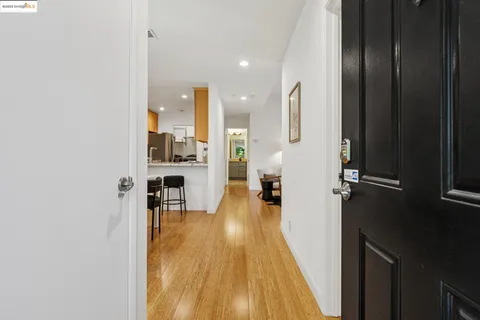 a view of a living room with a wooden floor