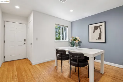 a dining room with wooden floor and breakfast area