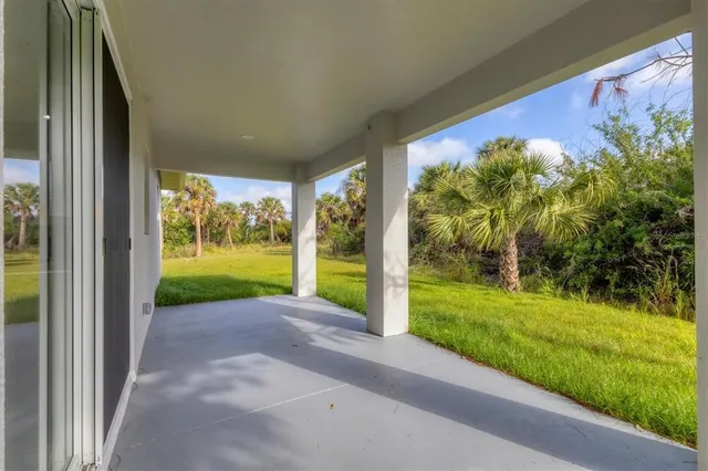 a view of a porch and garden