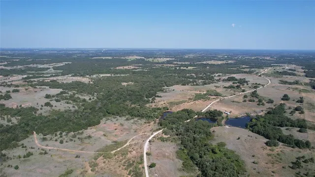 an aerial view of house with yard