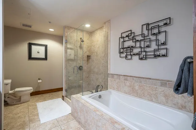a bathroom with a bathtub and a shower