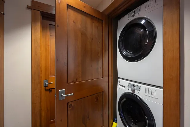 a view of a hallway with washer and dryer