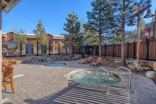 a view of a swimming pool with sitting area