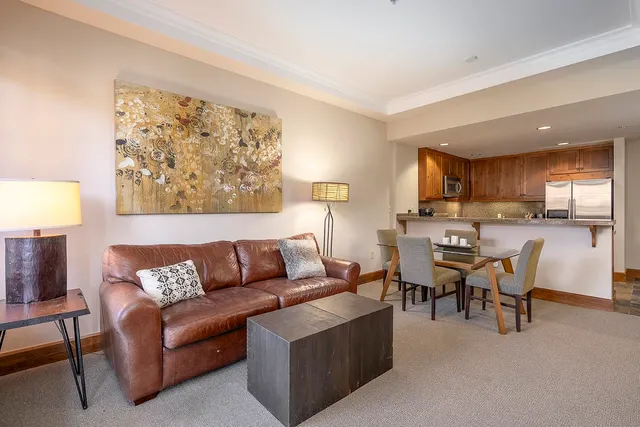 a view of a livingroom with furniture and a window
