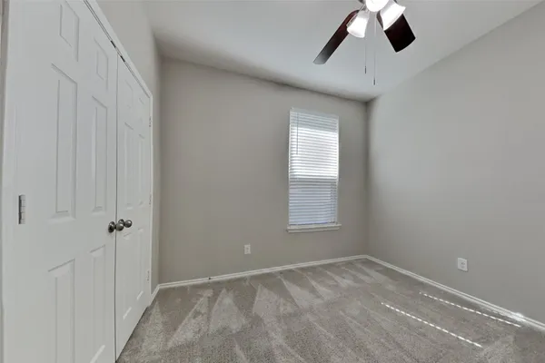 a view of empty room with windows