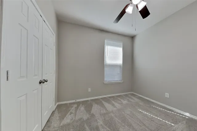 a view of empty room with windows